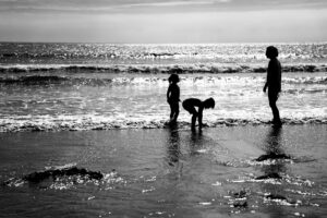 Silhouette of Mother & children at Wembury beach