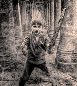 A boy with a plastic sword. Composition with two photos